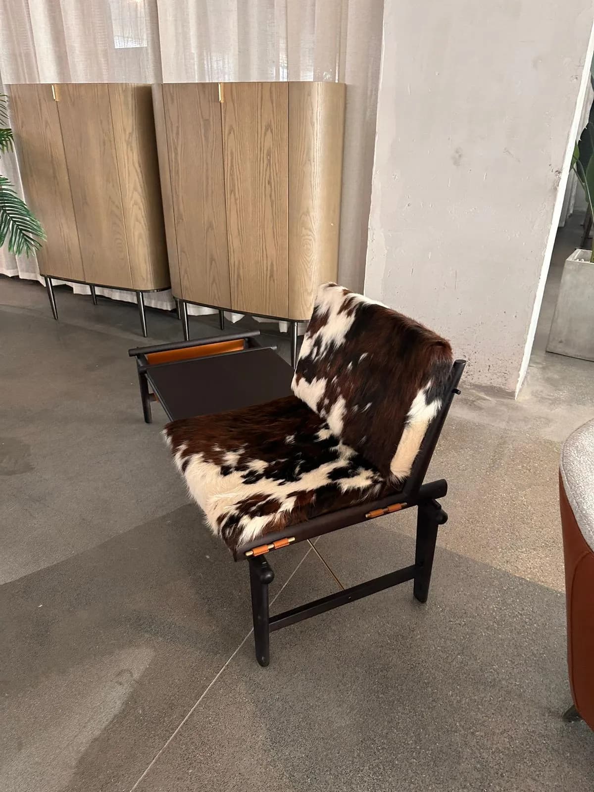 Modern Lounge Chair — Cowhide and Black Metal