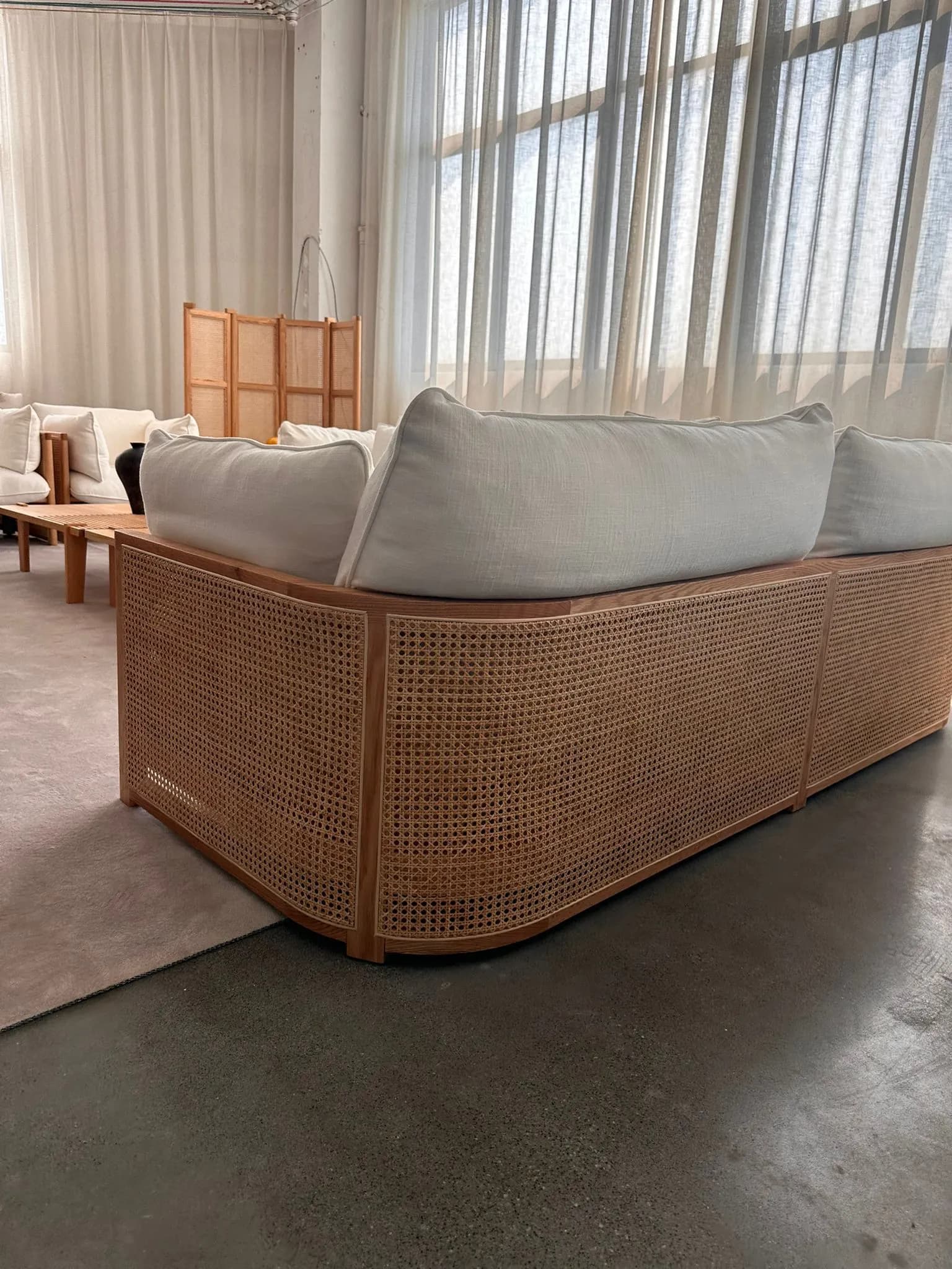 Rattan Curved Sectional — Rattan wood frame with gray linen upholstery